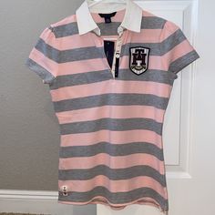 New With Tags. Preppy Pink Short Sleeve Shirt, Sporty Pink Collared Top, Preppy Pink Collared Top, Pink Sporty Collared Top, Casual Pink Top With Striped Collar, Fitted Sporty Tops By Tommy Hilfiger, Preppy Fitted Pink Top, Casual Pink Shirt With Striped Collar, Pink Short Sleeve Top With Striped Collar