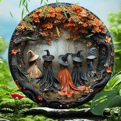 an image of three witches in the middle of a forest with trees and leaves around them