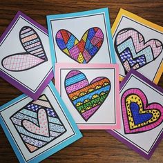 four colorful cards with hearts on them