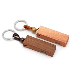 two wooden keychains with beads on them