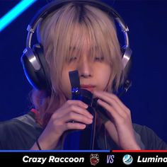 a person wearing headphones and holding a microphone in front of their face with the caption crazy raccoon vs lumino