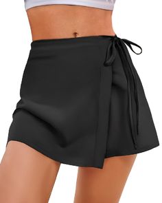 PRICES MAY VARY. Swim Skirt: Our swim skirt boasts a chic wrap design, elegantly secured by a side tie. The minimalist aesthetic is further enhanced by a thin waist belt, adding a touch of sophistication to your beachwear. High Waisted & Tummy Control: The high-waisted women's swim skirt is designed to reach the belly button, it offers effective tummy control without excessive tightness. The thin waistband ensures a comfortable fit, while the side ties keep the skirt securely in place, preventin Swim Wrap Skirt, Swim Wrap, Bathing Suit Skirt, Swimsuit Skirt, Skirt Swimsuit, Bathing Suit Bottoms, Skirt For Women, Swim Skirt, Designer Swimwear