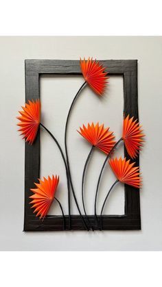 an art piece with orange flowers on it