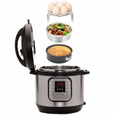 an electric pressure cooker with food in it and eggs above the pot on top