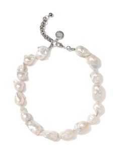 Introducing our Moonlit Pearl Necklace - a baroque beauty that adds elegance to any outfit. With its shimmering white hue, this necklace is perfect for day or night, making it a versatile piece for any occasion. Shine brighter than the moon with this stunning pearl necklace. 16" Baroque pearl necklace 2" extension Lobster clasp closure Silver plated brass hardware Handmade in New York City and Puerto Rico. Due to the handmade nature of our products, some charms may vary in color and style or be Baroque Pearl Necklace, Hair Rings, Necklace White, Baroque Pearls, Brass Hardware, Shine Bright, Ring Bracelet, Men Necklace, Bracelet Set