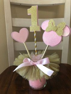 pink and gold minnie mouse birthday centerpiece in a mason jar