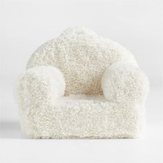 a white chair that is shaped like a teddy bear with fluffy fur on the back