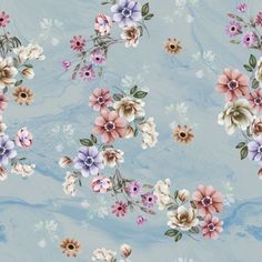 a blue floral wallpaper with pink, purple and white flowers on it's side