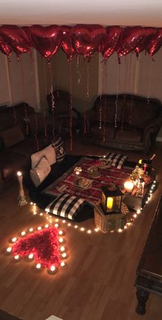 a living room filled with lots of furniture and lights on the floor next to a couch