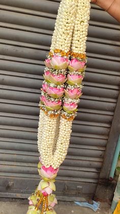 a bunch of food that is hanging from a pole in front of a garage door