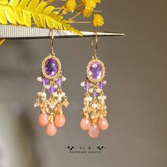 ♢ FEATURES & MATERIALS ~Peach Moonstone:natural colour,6*8mm,2mm ~Pearl : white freshwater pearl,natural colour,made in China,2-3mm ~Amethyst:natural colour,8*10mm,3mm ~Materials: 14K Gold Filled Moonstone is June birthstone I can't wait to recommend these gorgeous earrings, they are my favorite gemstone earrings! I used  amethyst and peach moonstone drops with mini pearls, they are stunning as they sway around the ears! It's perfect for weddings, parties and banquets. All metals are filled with Wedding Dangle Chandelier Earrings With Gemstone Accents, Wedding Chandelier Earrings With Gemstone Accents, Handmade Amethyst Chandelier Earrings, Handmade Elegant Amethyst Chandelier Earrings, Fine Jewelry Gemstone Chandelier Dangle Earrings, Gemstone Dangle Chandelier Earrings For Anniversary, Fusion Style Dangle Earrings With Gemstone Accents, Dangle Earrings With Gemstone Accents For Anniversary, Exquisite Dangle Earrings With Gemstone Accents