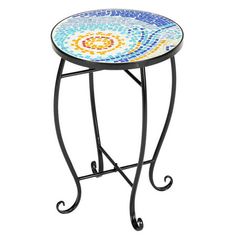 a small table with a mosaic design on the top and metal legs, sitting against a white background