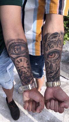 two people holding hands with tattoos on their arms and the other hand has an eye in it