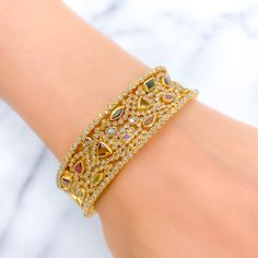 PRODUCT DETAILS Gold Purity(karat): 22k Item Weight(grams): 46.7 Item Finish: Yellow Gold Stone: Polki Diamond Diamond Weight(carats): 10.55ct Accented Stone: Tourmaline Stone Weight: 6.44ct Bangle Size: 2.4 Bangle Opening: 2.25" Openable: Yes, Hinge w/ Screw Gold Diamond Multi-stone Bracelets, Gold Diamond Bracelets With Multi-stones, Elegant Gold Bangle With Multi-stone Details, Elegant Gold Bangle With Multi-stone, Gold Jeweled Fusion Bangle, Gold Bangle With Gemstone Accents, Gold Fusion Multi-stone Bracelets, Gold Fusion Style Jeweled Bangle, Gold Cubic Zirconia Bracelet With Gemstone Accents