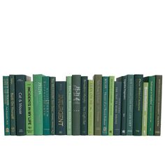 a row of books sitting on top of each other in front of a white background