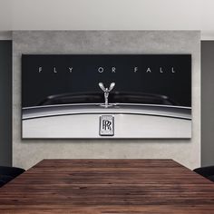 a table and chairs in a room with a poster on the wall above it that says fly or fail