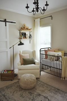 a baby's room with a crib, rocking chair, and bookshelf