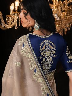 This stunning beige sequin saree drapes beautifully, adorned with delicate embroidery for a touch of modern glamour. The contrasting navy blue blouse adds a sophisticated edge. it's ideal for weddings, parties, or any special occasion. SAREE SPECIFICATIONS:Fabric: FancyColour: Beige Work Type: Sequins Embroidered BLOUSE SPECIFICATIONS:Fabric: FancyColour: Navy BlueWork Type: Sequins EmbroideredStitching Type: Un-Stitched SET CONTAIN:Saree With Blouse Piece In The Box: 1 Saree :: 1 Blouse Piece,Saree : 5.50Mtr :: Blouse Piece: 0.80Mtr LEGAL DESCRIPTION:There Might Be Minor Colour Variation Between the Actual Product And the Image Shown On Screen Due To Lighting in the Photography. Blue Saree Contrast Blouse, Shimmer Saree, Saree Drapes, Navy Blue Saree, Wedding Sarees Online, Sequin Saree, Royal Blue Blouse, Reception Gown, Bollywood Lehenga