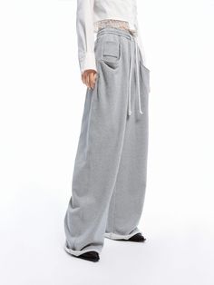 MO&Co. Women's Drawstring Wide Leg Pants Get ready to experience ultimate comfort with our pants! Made from pure cotton, these pants are soft and cozy to wear. With a drawstring waistband and side pockets, you can move freely and carry your essentials easily. Embrace a relaxed yet stylish look with our wide-leg design. Features : - High waist, wide leg- Elastic waistband with drawstring- Side slanting pockets, raw hem Code: MBD1PATT09The back length of size M is 110cmMATERIALS & CARE Material: 1 Drawstring Waistband, Moda Fashion, Pure Cotton, Black Pants, Wide Leg Pants, Gray Color, Wide Leg, Pants For Women, Trousers