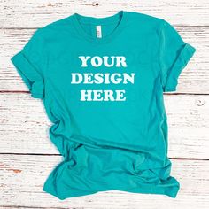 "Bella Canvas Mockup, 3001 Teal T shirt Mockup, Turquoise Shirt Mock Up, Flat Lay, Summer T shirt Mockup, Basic Mockup, Print on Deman Mockup >> PLEASE FEEL FREE TO REACH OUT TO ME IN AN ETSY MESSAGE IF YOU HAVE ANY QUESTIONS.  PLEASE NOTE: THIS IS A DIGITAL FILE/DOWNLOAD, THERE WILL BE NO PHYSICAL PRODUCT SENT TO YOU AND ALL SALES ARE FINAL - NO RETURNS OR REFUNDS ARE ACCEPTED  *DETAILS: ~ Size: 2000 x 2000 ~ Delivered: instantly after purchase ~ JPG file compatible with Photoshop, Photoshop Elements & others ~ Files are delivered without text (add your own). ~ Downloaded file will NOT have \"Mod Girl Mockups\" watermark *TERMS OF USE: When purchasing a digital photo mockup from ModGirlMockups the buyer acknowledges and agrees to use the photo in accordance with the TERMS and CONDITIONS o Customizable Blue T-shirt Relaxed Fit, Customizable Blue Crew Neck Shirt, Customizable Blue T-shirt With Relaxed Fit, Casual Customizable Blue T-shirt, Customizable Blue Relaxed Fit T-shirt, Blue Customizable Relaxed Fit T-shirt, Customizable Blue Short Sleeve T-shirt, Blue Cotton T-shirt With Custom Print, Customizable Blue Tops With Relaxed Fit