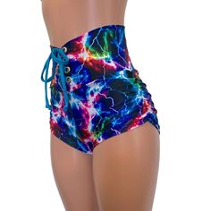 High-waisted booty shorts made in sparkle cosmic thunder UV Glow print stretchy performance spandex with ruching on the sides and lace-up detail in front. Made to flatter your figure and move with you. These booty shorts shine in different colors in the light - for a true holographic effect. The standard inseam is 2.5" - but can be customized. Jessie Graff, White Jogger Pants, Festival Pants, Black Faux Leather Leggings, Pole Fitness, Roller Derby, Rave Outfits, High Waist, Lace Up