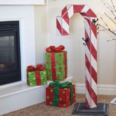 DIY WOODEN CANDY CANE GIFT HANGER WOODWORKING PLAN This post will show you how to make your own DIY Wooden Candy Cane Gift Hanger! This little tree shelf is the perfect place for little nick-knacks and special things. We also hang our stockings on here, and you guys, it looks SO pretty! Easy for everyone! Instant Download Candy Cane Gifts, Christmas Diy Wood, Christmas Stockings Diy, Stocking Holder, Christmas Stocking Holders, Christmas Wood Crafts, Holiday Candy, Free Plans, Holiday Stockings