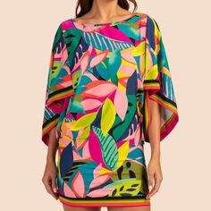 Step Into This This Colorful, Drape-Sleeve Tunic For Vacation-Ready Style That Goes From Beach To Dinner In A Snap. Made Of Lightweight Swim Jersey, This Cover-Up Tunic Can Be Worn Over A Swimsuit Or As A Top, Paired With Your Favorite Shorts...Or Pants, Or Skirt, Or Jeans... Boatneck 3/4-Length, Wide Sleeves Placed Print Border At Sleeves And Hem Fitted At Hips Runs Small Spring Beachwear Top With Vibrant Print, Summer Blouse With Tropical Print In Pink, Summer Pink Blouse With Tropical Print, Multicolor Tropical Long Sleeve Blouse, Tropical Multicolor Long Sleeve Blouse, Multicolor Long Sleeve Tropical Blouse, Pink Printed Beachwear Top, Vibrant Green Blouse For Vacation, Vibrant Green Vacation Blouse