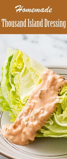 a plate with lettuce and dressing on it