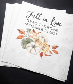 two wedding napkins with fall in love on them