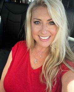 a woman sitting in the back seat of a car