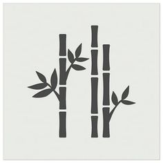 an image of three bamboos with leaves on them in black and white paper cut outs