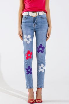 Elevate your denim game with our High Waisted Light Washed Skinny Jeans, adorned with a multicolor flower detail. These jeans feature a skinny fit that hugs your curves, and a high waist for a flattering silhouette. Made from a blend of 99% cotton and 1% elastane, they offer just the right amount of stretch for comfort and flexibility. The embroidered floral print adds a touch of boho charm, making these jeans perfect for any casual occasion. Please note that these jeans run small, so consider sizing up for the best fit. Model Info: Model is wearing size S. Model's measurements: 33-23-35, Height: 5'9''. Key Features: Skinny fit with high waist for a flattering silhouette. Multicolor embroidered flower detail for a touch of boho charm. Made from stretch denim for comfort and flexibility. Fi Trendy Denim Bottoms With Floral Print, Blue Denim Jeans With Floral Print, Trendy Floral Print Cotton Jeans, Trendy Floral Embroidered Fitted Jeans, Trendy Blue Jeans With Floral Embroidery, Trendy Fitted Jeans With Floral Embroidery, High Waist Floral Embroidery Jeans For Spring, Mid-rise Denim Bottoms With Floral Print, High Waist Floral Print Jeans