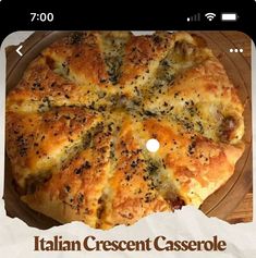 a pizza sitting on top of a pan covered in cheese and toppings with the words italian crescent casserole