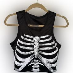 I Believe It Be Polyester. It’s Basically Brand New! Only Has Been Worn A Few Times If That Casual Black Crop Top For Halloween, Black Stretch Crop Top For Halloween, Black Stretch Tank Top For Halloween, Black Sleeveless Crop Top For Halloween, Trendy Black Tank Top For Halloween, Casual Black Skull Print Tank Top, Casual Black Tank Top With Skull Print, Rib Cage, Crop Tank