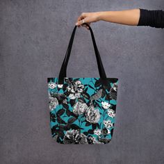 Make a statement with our stunning floral tote bag, perfect for carrying your essentials in style.  The vibrant floral print adds a pop of color to any outfit, while the sturdy canvas material ensures durability and longevity. With plenty of room to store your everyday items, this spacious tote features both interior and exterior pockets for easy organization.  The comfortable shoulder straps make it easy to carry, whether you're running errands or heading to the beach. Versatile and chic, this Trendy Cotton Bags With Floral Print, Floral Print Canvas Tote Bag For Daily Use, Floral Print Canvas Tote Bag For Everyday Use, Travel Cotton Bag With Floral Print, Casual Canvas Bag With Floral Print For Shopping, Travel Bag With Floral Print In Cotton, Everyday Floral Print Canvas Tote Bag, Cotton Travel Bag With Floral Print, Spring Travel Canvas Bag With Floral Print