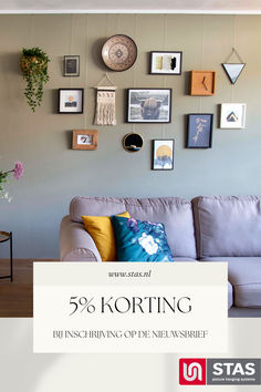 a living room filled with furniture and lots of framed pictures on the wall above it