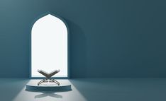 a chair sitting on top of a white floor in front of a blue wall with an arched window