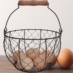 eggs in a wire basket next to an egg holder