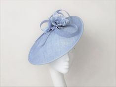 This chic pale blue looped headpiece and silk flowers will make a great addition to any wedding or race day outfit.  Colour can be matched for your requirements.  Free express delivery email rubybosebridal @ gmail .com and I will sort that out for you  through my website Handmade using the highest quality materials.  The disc is approx 36 cm in diam Secured with hairbands in a choice of colours to blend your hair colour. Each piece is handmade by me, for you, using the highest quality materials which takes about 5 days. If you have a specific date you need the headpiece please get in touch and I will ensure you receive in good time. If you would like the piece to be made to match your outfit, or adapted please contact me (a swatch can be sent or matched to your required colour) Presented i Diy Derby Hat Ideas, Diy Kentucky Derby Hat, Hat Wedding Guest, Cornflower Blue Wedding, Fascinator Hats Diy, Pale Blue Dresses, Blue Fascinator, Race Day Outfits, Ascot Hats