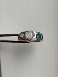 Gorgeous aussie opals containing all the colors and glitter of the universe  Set in sterling silver. Made using the lost wax method, for that chunky look ���👀  Size 54 mm circumference, 17 mm diameter, 17 DE, 7 US, N UK Can be sized up Handmade Silver Multi-stone Opal Ring As Gift, Unique Ethiopian Opal Ring, Iridescent Opal Ring With Unique Style, Silver Multi-stone Ethiopian Opal Jewelry, Unique Iridescent Round Opal Ring, Artisan Silver Opal Ring, Iridescent Opal Ring In Sterling Silver For Anniversary, Multi-stone Sterling Silver Opal Ring, Unique Hallmarked Sterling Silver Opal Ring