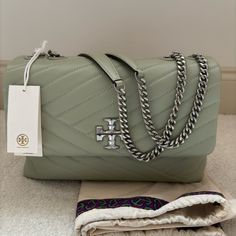 New Mint Green Tory Burch Bag, Unused, Never Worn. Brand New With Tags, Dust Bag Included. Can Be Worn As A Crossbody Or Shoulder Bag. Leather Exterior With Fabric Interior. Tory Burch Miller Handbag, Tory Burch Green Bucket Bag, Tory Burch Crossbody Handbags, Leather Crossbody Bag Tory Burch, Cell Phone Holster, Tory Burch Bags, Phone Holster, Tory Burch Bag, Walker Boots