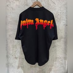 Palm Angels T Shirt New With Tags Logo Tops For Streetwear With Short Sleeves, Logo Short Sleeve Tops For Streetwear, Short Sleeve Logo Tops For Streetwear, Short Sleeve Tops For Streetwear, Oversized Black T-shirt With Logo, Oversized Black Logo Top, Black Logo Top With Short Sleeves, Black Short Sleeve Tops With Logo, Black Graphic Tee With Logo