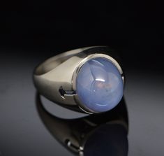 This is a Men's 20K White Gold Star Sapphire High Dome Cabochon, Lavender shade, approximately 10 carat stone, Circa 1960's, Ring size 9, Weight 14.4 grams. Stock # BB68R01 Gold Claddagh Ring, Star Sapphire, Blue Band, Size 10 Rings, Blue Topaz Ring, Topaz Ring, Gold Stars, Pink Tourmaline, Blue Topaz