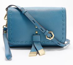 Give us all the details! This leather crossbody lays on the charm with standout hardware and a retro-style flap. And with a wristlet strap and built-in card slots, the mid-size style is an easy grab-and-go when you're meeting the girls or heading to an event. From LODIS. Leather Crossbody Wallet On Chain With Adjustable Strap, Leather Wallet On Chain With Adjustable Strap, Crossbody Wallet On Chain With Branded Hardware, Leather Wallet On Chain With Metal Hardware, Crossbody Wallet On Chain With Adjustable Strap, Adaptive Clothing, Koolaburra By Ugg, Beauty Storage, American Leather