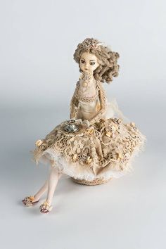 a doll sitting on top of a table