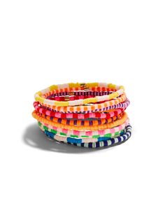 These stackable bracelets from Roxanne Assoulin exude joy and are the perfect every day addition to your arm stack! Detailed in multicolor beads. Sold as a set of ten. Measures approximately 2" x 2" inner diameter. Multicolor Stackable Wrap Bracelet, Casual Multicolor Stackable Friendship Bracelets, Everyday Multicolor Stacked Jewelry, Everyday Multicolor Stackable Stretch Bracelet, Everyday Multicolor Beaded Wrap Bracelet, Multicolor Stackable Friendship Bracelets For Beach, Playful Multicolor Stackable Bracelets, Multicolor Stacked Bracelets For Beach, Arm Stack