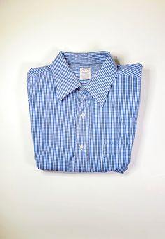 "Brooks Brothers Casual Shirt Blue & White Checkered 100% Cotton Button Down (Size Large) MEASUREMENTS: Men's Regular Large Size: 16-33 Fits true to Size 16 inch- Collar Size 22 inch- Shoulder Seam to Shoulder Seam  22 inch- Arm Pit to Arm Pit   24 inch- Shoulder Seam to Bottom Hem *If shirt does not fit please see our return policy. FEATURES:  ★ French Cuffs ★ 100% Cotton ★ Left Pocket Square  ★ Made in USA ★ Authentic Vintage  ★ Secure Packaging ★ Excellent Condition: pre-worn ★ Fast Processing (Usually 1-2 Business Days) ★ Eco-Friendly: We Recycle Shipping Products!  ★ Product Protection with (Included Insurance) ★ Fast Shipping (Usually Next Day) ★ Bulk Orders are Packed Together Similar Items:  ★Brooks Brothers Casual Shirt Red & White Stripped Poplin Cotton Button Down (Size Large) Shipping Products, Mens Oxfords, Casual Shirt, Brooks Brothers, Pocket Square, Silk Ties, Large Size, Button Downs, Size 16