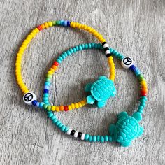 I love these turtle beads. Made a bracelet with them as soon as they arrived and couldn't wait to get them in my Etsy shop. Quality Czech glass beads in solid colours. Choose your main colour. The rainbow and the black and white will stay the same on whichever colour you chose. Shown in golden yellow and turquoise. Available immediately 4 different sizes but if you require a different size, just ask. Everything is made to order so I can make it suitable for you. Casual Turquoise Beads For Beach, Casual Beach Bracelet Beads, Playful Round Beads Friendship Bracelets For Beach, Playful Turquoise Beaded Bracelets For Beach, Playful Adjustable Turquoise Beaded Bracelets, Hippie Colorful Beaded Bracelets For Beach, Hippie Green Bracelets For Beach, Hippie Green Bracelet For Beach, Green Hippie Beach Bracelets