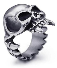 In the vampire species, the canines are fundamental to enable them to drive their fangs into the necks of their victims. with the skull ring vampire fangs, you're immune! Stainless Steel 316L : does not blacken, resistant to chlorine No form of discomfort on your skin Neat details Weight: 20gr STANDARD SHIPPING OFFERED ☠️ Refer to our MEASURING GUIDE if you're not sure what size to order.. ☠️👉Discover our collection Skull Rings Satanic Star, Skull Vampire, Vampire Ring, Pirate Ring, Warrior Ring, Jewelry Skull, Viking Skull, Austrian Empire, Rock Rings