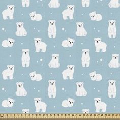 a blue background with white polar bears and snowflakes on it, as well as a ruler